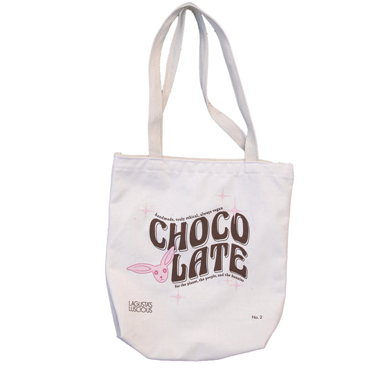 white tote bag with pink bunny graphic and brown text that reads "handmade, truly ethical, always vegan chocolate for the planet, the people, and the bunnies